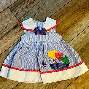 Vintage baby girls dress with sailboat